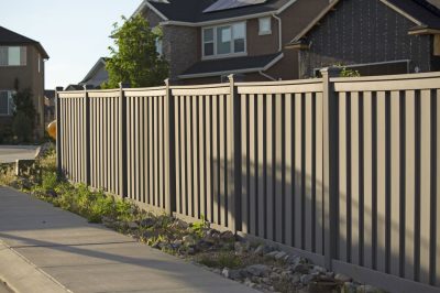 Shot of the fence around the house in the neighborhood during the sunset. Fence Painting St John